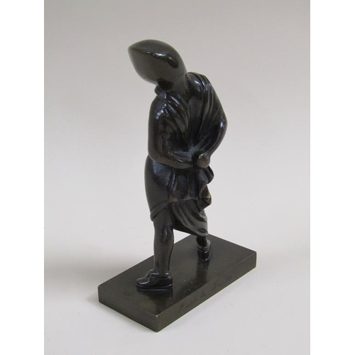 23 - A late 19c/early 20c patinated bronze figure of a young girl with hood and cloak, 17cm h.