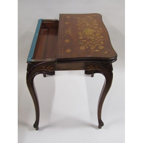 258 - A 19c mahogany fold over card table with profuse marquetry decoration, supported on shaped and mould... 