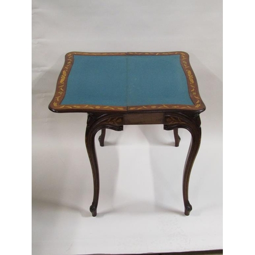 258 - A 19c mahogany fold over card table with profuse marquetry decoration, supported on shaped and mould... 