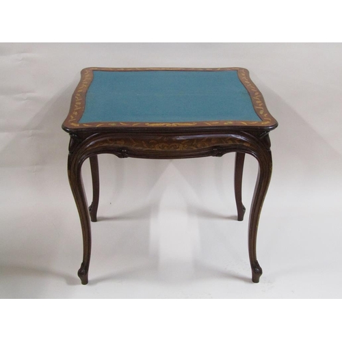 258 - A 19c mahogany fold over card table with profuse marquetry decoration, supported on shaped and mould... 