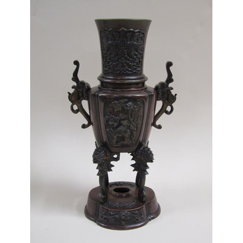 27 - A pair of late 19c Oriental patinated censer vases, two handled and having four legs supported on lo... 