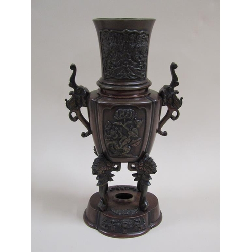 27 - A pair of late 19c Oriental patinated censer vases, two handled and having four legs supported on lo... 