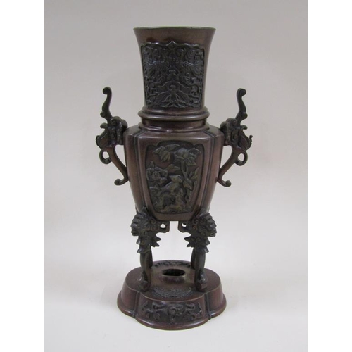 27 - A pair of late 19c Oriental patinated censer vases, two handled and having four legs supported on lo... 