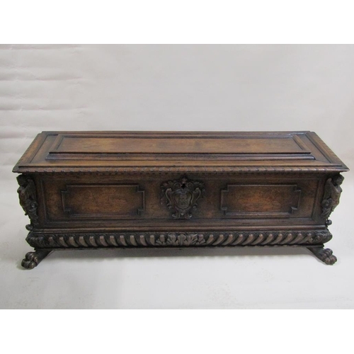 278 - An early 19c Italian walnut cassone of large proportion with geometric panels and a central castle t... 