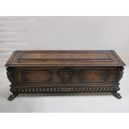 278 - An early 19c Italian walnut cassone of large proportion with geometric panels and a central castle t... 