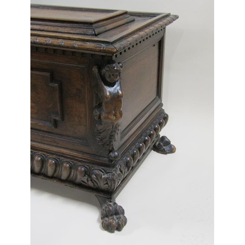 278 - An early 19c Italian walnut cassone of large proportion with geometric panels and a central castle t... 