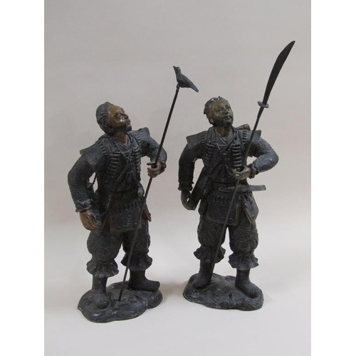 28 - A pair of early 20c patinated bronze Japanese warrior figures, cast in earlier period costume, one w... 