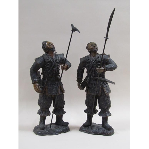 28 - A pair of early 20c patinated bronze Japanese warrior figures, cast in earlier period costume, one w... 