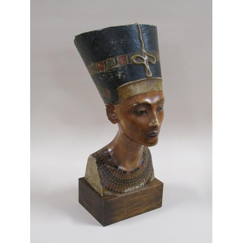 29 - An early 20c bust of Nefertiti from the  Berlin Museum replica workshop, on wooden plinth, stamped o... 