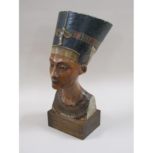 29 - An early 20c bust of Nefertiti from the  Berlin Museum replica workshop, on wooden plinth, stamped o... 