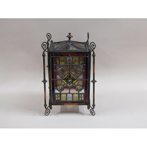 31 - An early 20c Gothic style lantern shade with leaded coloured glass panels within a coppered iron fra... 