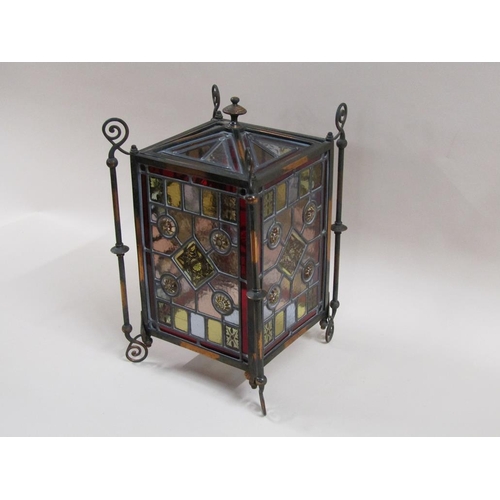 31 - An early 20c Gothic style lantern shade with leaded coloured glass panels within a coppered iron fra... 