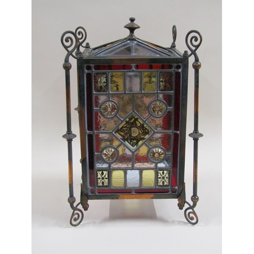 31 - An early 20c Gothic style lantern shade with leaded coloured glass panels within a coppered iron fra... 