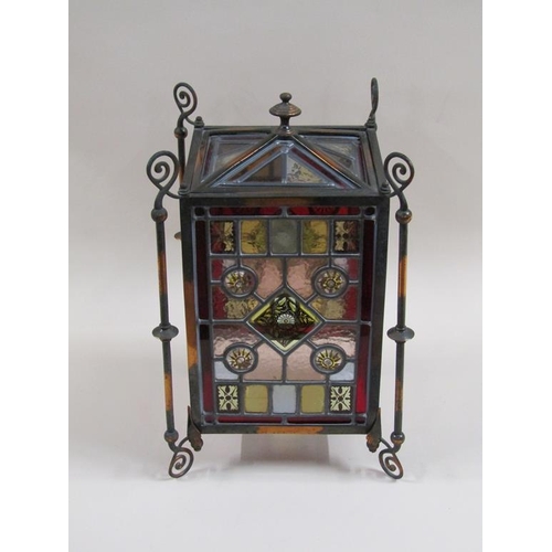 31 - An early 20c Gothic style lantern shade with leaded coloured glass panels within a coppered iron fra... 