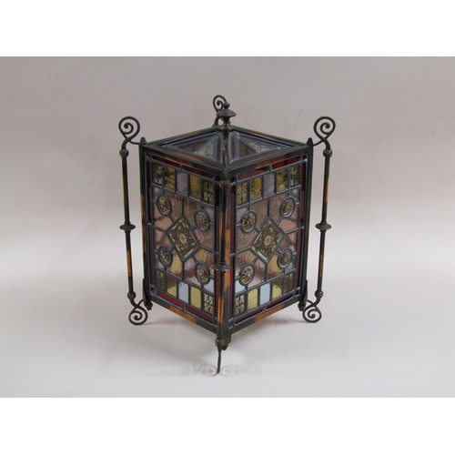 31 - An early 20c Gothic style lantern shade with leaded coloured glass panels within a coppered iron fra... 