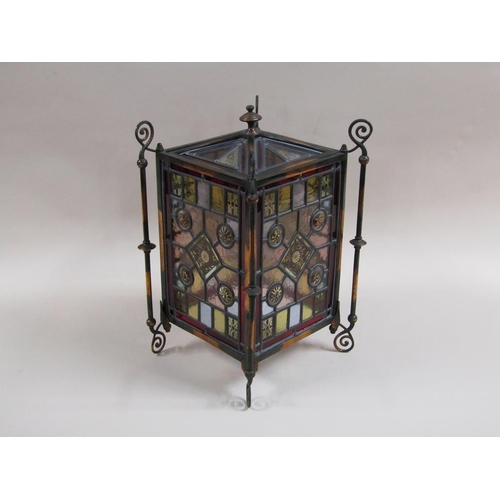 31 - An early 20c Gothic style lantern shade with leaded coloured glass panels within a coppered iron fra... 