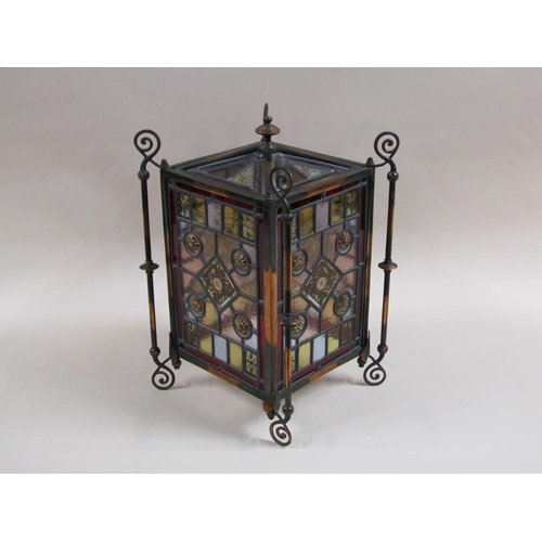 31 - An early 20c Gothic style lantern shade with leaded coloured glass panels within a coppered iron fra... 