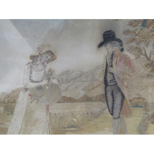 167 - An early 19c silk work picture of a lady and gentleman in a corn field, oval framed and glazed, 29cm... 