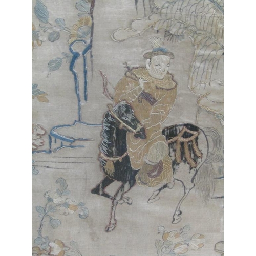 169 - A late 18c/early 19c Oriental silk work picture depicting and archer on horseback, framed and glazed... 