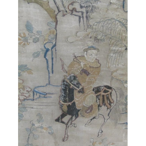 169 - A late 18c/early 19c Oriental silk work picture depicting and archer on horseback, framed and glazed... 