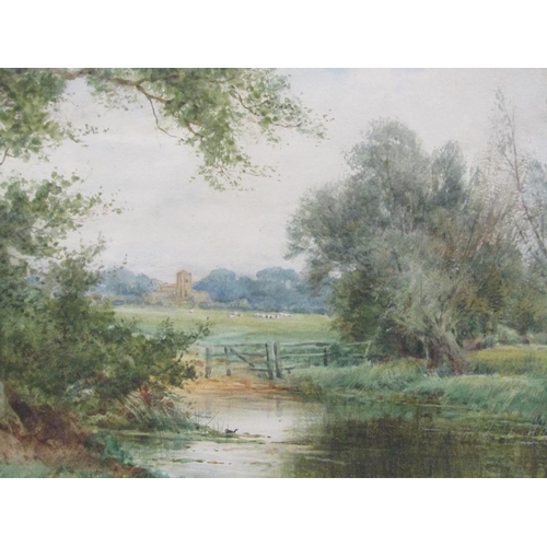 186 - Sylvester Stannard - River with meadow beyond and church, signed watercolour, framed and glazed, 25c... 