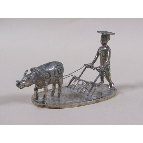 65 - A late 19c/early 20c group of three Chinese silver miniatures comprising a weaving loom, farmer cult... 