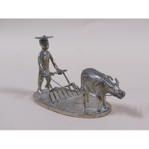 65 - A late 19c/early 20c group of three Chinese silver miniatures comprising a weaving loom, farmer cult... 