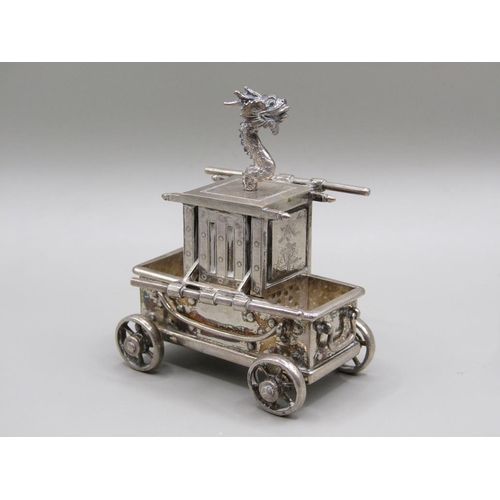 67 - A late 19c/early 20c Chinese silver four wheeled vehicle carrying a boxed compartment, surmounted by... 