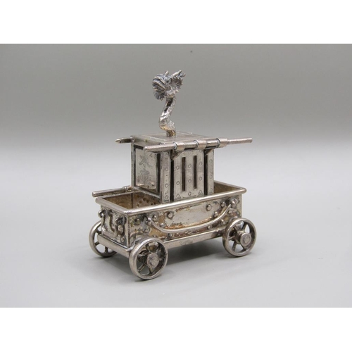 67 - A late 19c/early 20c Chinese silver four wheeled vehicle carrying a boxed compartment, surmounted by... 