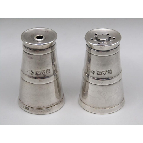 73 - A pair of silver miniature milk churn condiments, pepper and salt, Chester 1920, 4cm h.