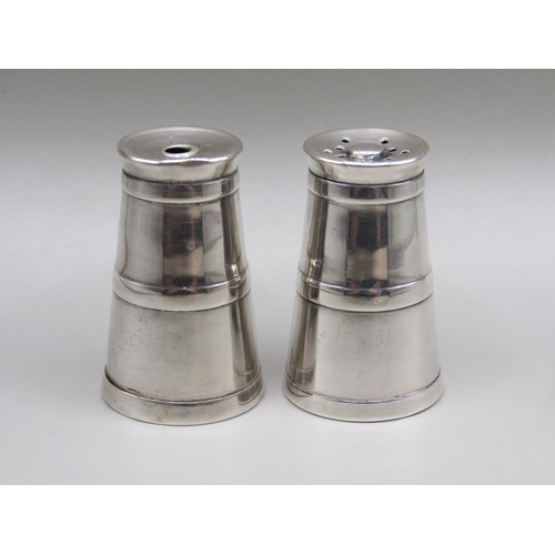 73 - A pair of silver miniature milk churn condiments, pepper and salt, Chester 1920, 4cm h.