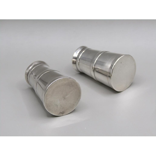 73 - A pair of silver miniature milk churn condiments, pepper and salt, Chester 1920, 4cm h.