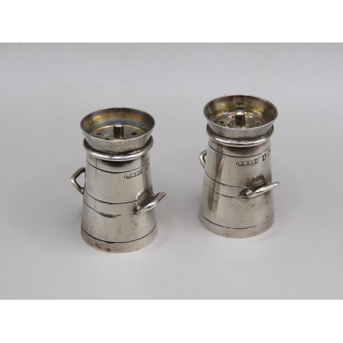 74 - A pair of silver miniature pepperette milk churns, Birmingham 1938, each 2.6 cm h.