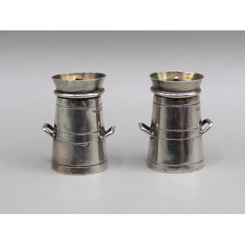 74 - A pair of silver miniature pepperette milk churns, Birmingham 1938, each 2.6 cm h.