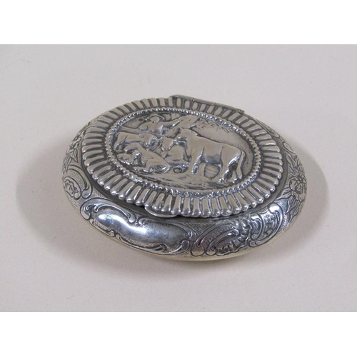 78 - An Edwardian Dutch tobacco box of oval form embossed and chased, the lid with a panel of cattle unde... 