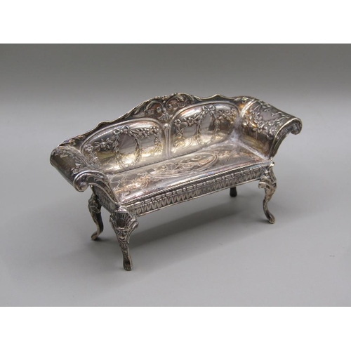 79 - An early 20c Continental silver miniature two seater sofa with scrolling arms and cabriole legs and ... 