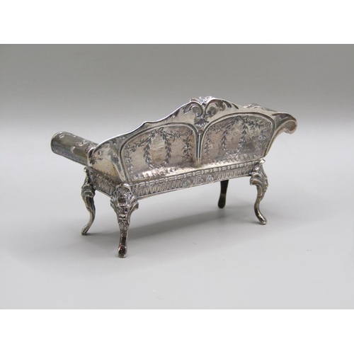 79 - An early 20c Continental silver miniature two seater sofa with scrolling arms and cabriole legs and ... 