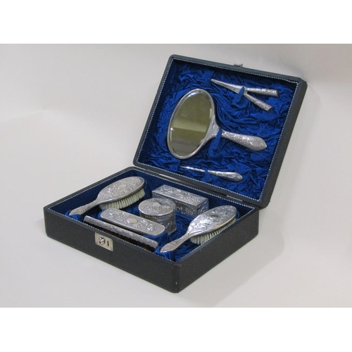 100 - A Japanese silver vanity set in travelling case by Zeewo, c.1925/30, comprising a hand mirror, three... 