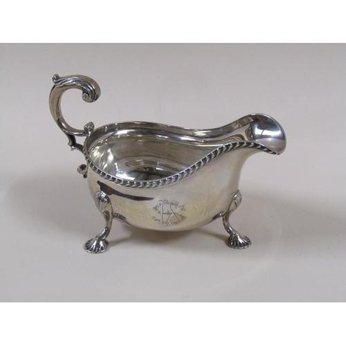 101 - A pair of Mappin & Webb Georgian style sauce boats with open double scroll handles, cast gadroon rim... 