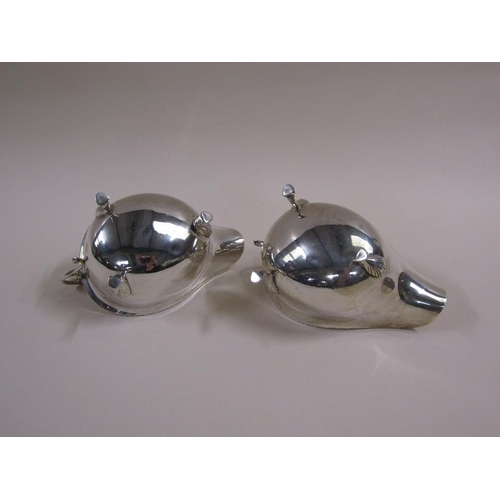 106 - A pair of Georgian style silver gravy boats with open scroll handles, bead and reel cast borders, ea... 