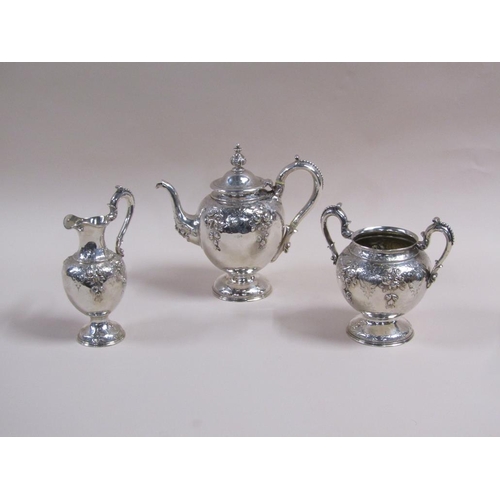 108 - A mid 19c three piece silver tea service, embossed and chased with leaf and flowers, makers mark for... 