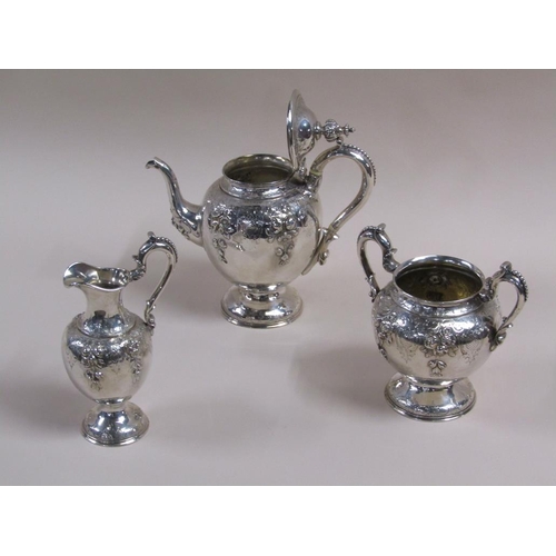 108 - A mid 19c three piece silver tea service, embossed and chased with leaf and flowers, makers mark for... 