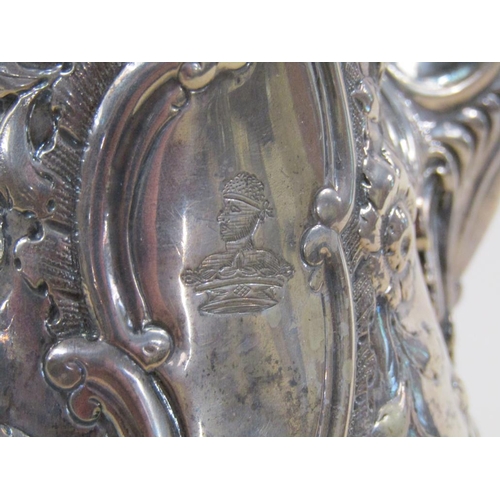 109 - An 18c silver coffee pot of baluster form, embossed and chased with later decoration, London 1767/8,... 