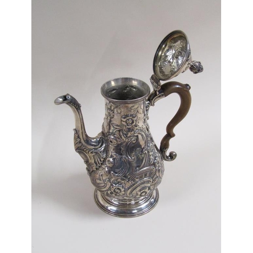 109 - An 18c silver coffee pot of baluster form, embossed and chased with later decoration, London 1767/8,... 