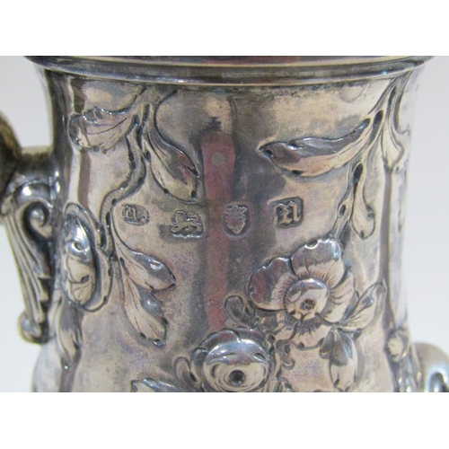 109 - An 18c silver coffee pot of baluster form, embossed and chased with later decoration, London 1767/8,... 