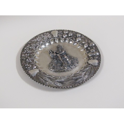 111 - A late 19c Continental silver dish of circular form with a central embossed and chased figure of a m... 