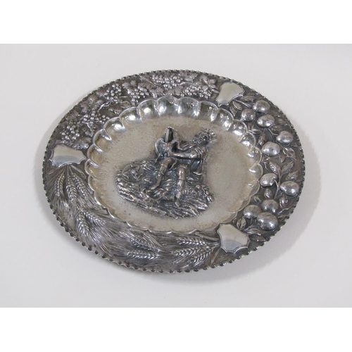 111 - A late 19c Continental silver dish of circular form with a central embossed and chased figure of a m... 