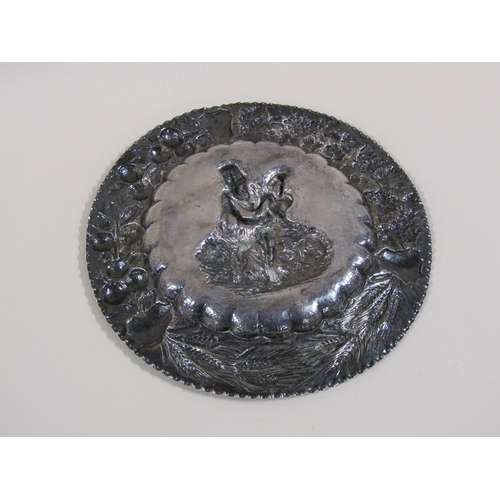 111 - A late 19c Continental silver dish of circular form with a central embossed and chased figure of a m... 