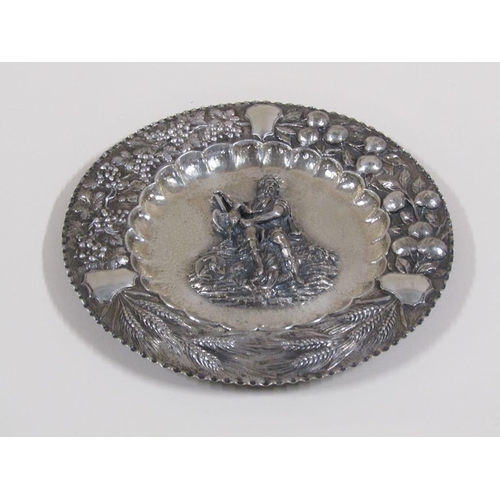 111 - A late 19c Continental silver dish of circular form with a central embossed and chased figure of a m... 