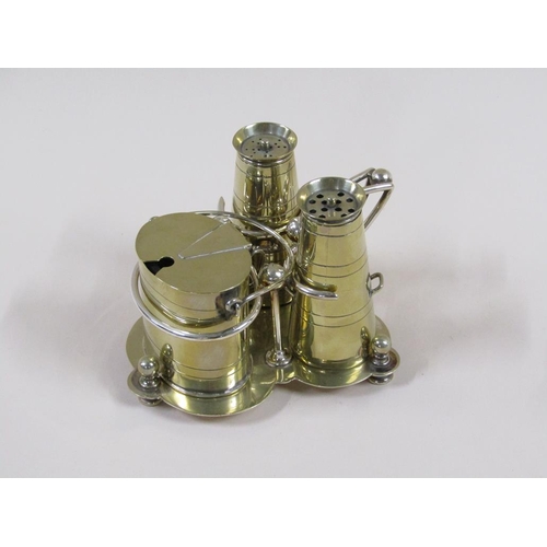 116 - An early 20c silver plate condiment set comprising milk churn shaped salt and pepper and a cream can... 